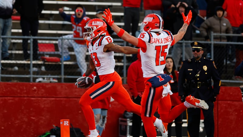 Illinois wide receiver Pat Bryant (13) scores a 40-yard touchdown after making a catch as...