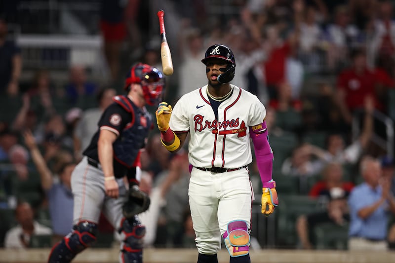 Atlanta Braves' Ronald Acuña Jr. flips his bat after hitting a solo home run in the sixth inning of a baseball game against the Washington Nationals, Tuesday, Sept. 23, 2025, in Atlanta. (AP Photo/Colin Hubbard)
