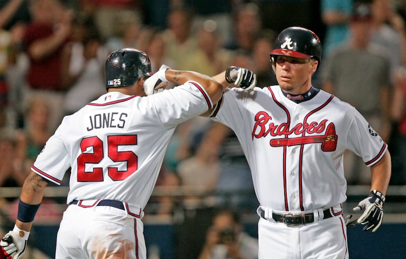 Atlanta Braves' Chipper Jones, right, celebrates with teammate Andruw Jones after hitting a solo home run in the sixth inning of a baseball game against the Philadelphia Phillies on Monday, April 30, 2007, in Atlanta. (AP Photo/John Bazemore)