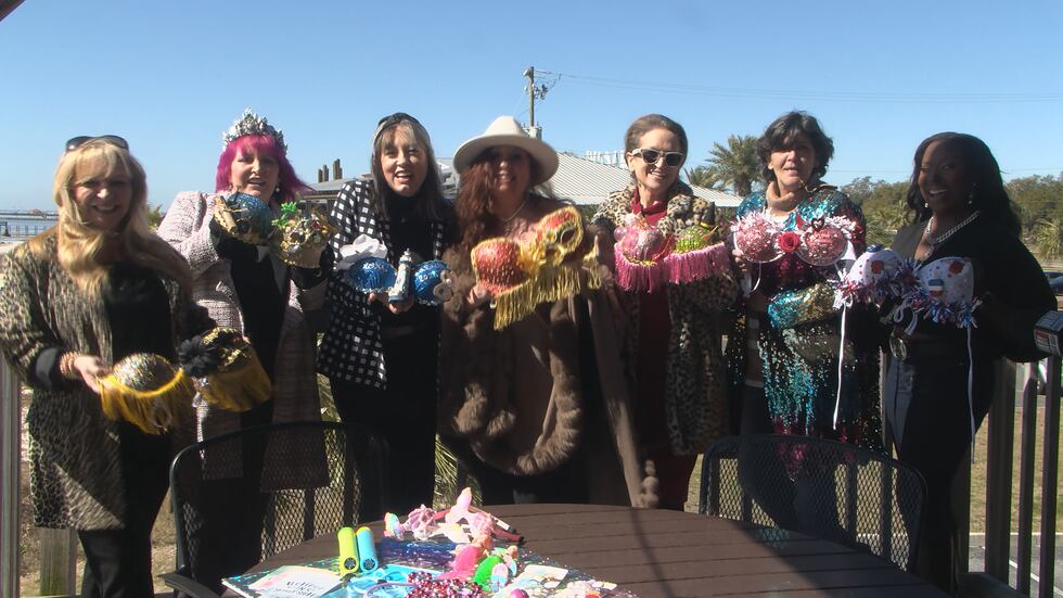 Krewe members pose with their customized bikini tops.