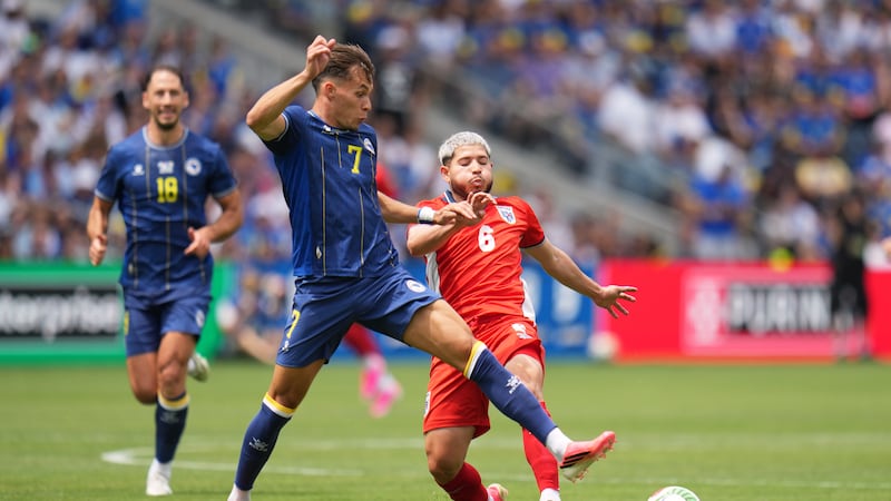 Bosnia's Amar Dedic (7) and Panama's Cristian Martinez (6) battle for the ball during the...