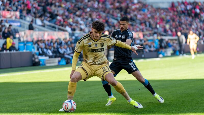 CITY SC's Dante Polvara fends of a Charlotte FC attacker.