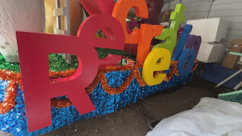 The Louisville Parks and Recreation float features horses having fun on playground equipment,...