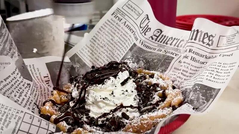 Preparing a Cookie Monster funnel cake.
