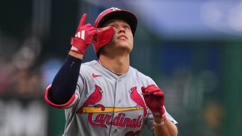 St. Louis Cardinals' JJ Wetherholt celebrates as he rounds third after leading off the...