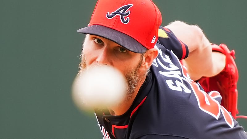 Atlanta Braves pitcher Chris Sale throws in the first inning of a spring training baseball...