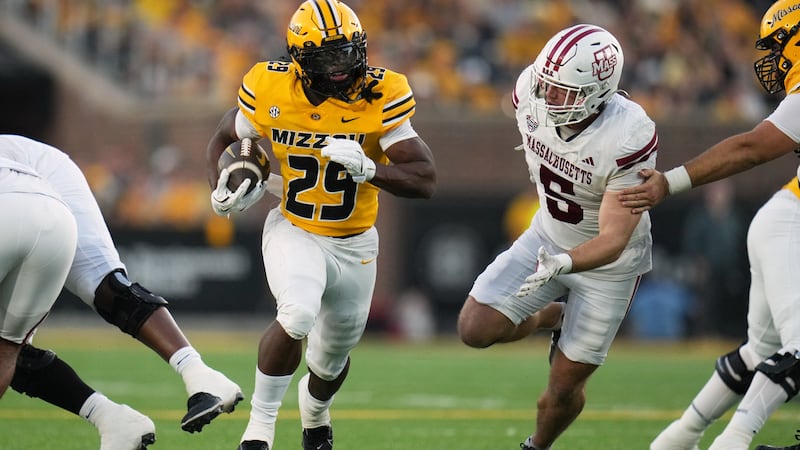 Missouri running back Ahmad Hardy (29) runs with the ball as Massachusetts linebacker Tyler...