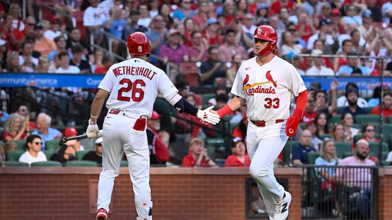 St. Louis Cardinals' Blaze Jordan (33) is congratulated by teammate JJ Wetherholt (26) after...