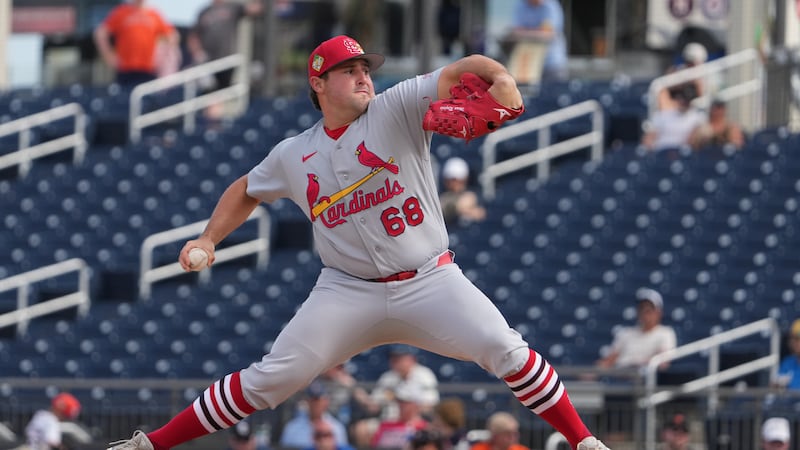 St. Louis Cardinals pitcher Max Rajcic throws during the fourth inning of a spring training...