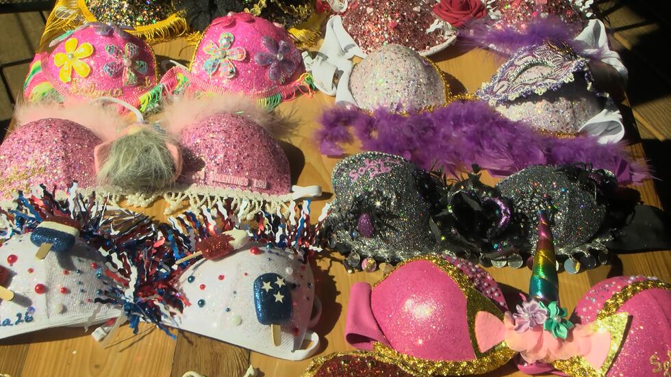 Members of the Krewe of Salacia decorate several bikini tops ahead of the parade.