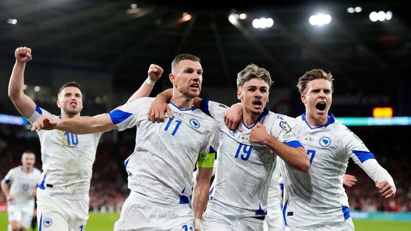 Bosnia and Herzegovina's Edin Dzeko, centre left, celebrates with team-mates after scoring...