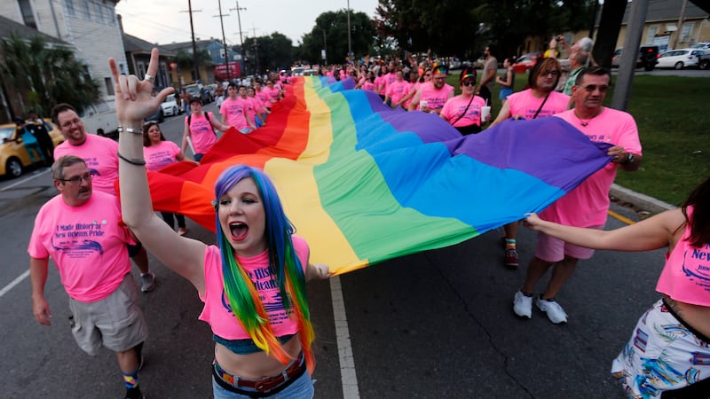 Participants march in the "New Orleans Pride" parade, a gay pride parade, in New Orleans,...