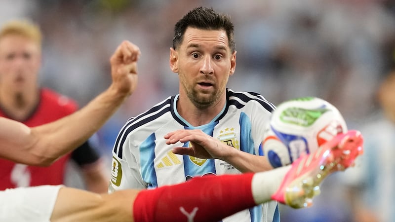 Argentina's Lionel Messi views the ball during the World Cup Group J soccer match against...