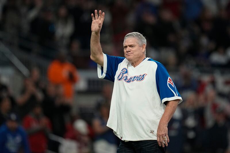 Former Major League Baseball player Dale Murphy waves to spectators before throwing out the ceremonial first pitch before Game 2 of baseball's National League Championship Series between the Atlanta Braves and the Los Angeles Dodgers Sunday, Oct. 17, 2021, in Atlanta. (AP Photo/Ashley Landis, file)