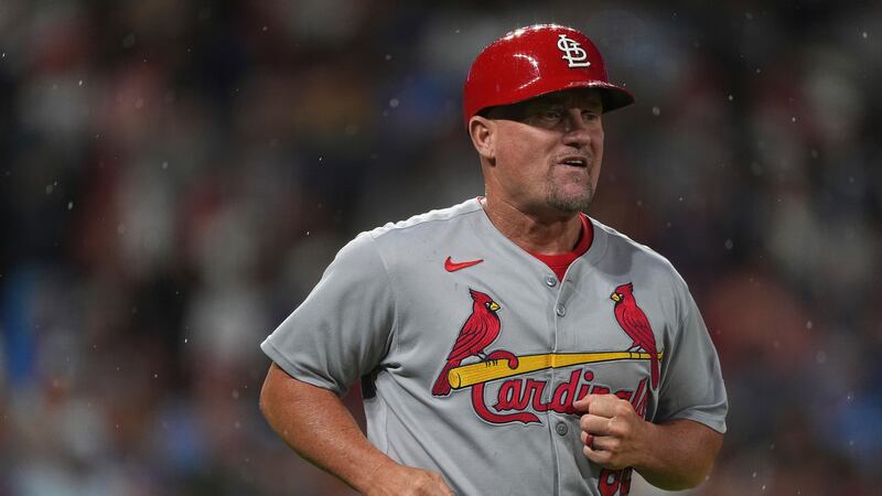 St. Louis Cardinals first base coach Stubby Clapp (82) in the seventh inning of a baseball...