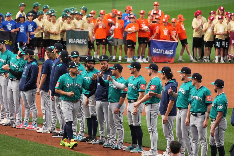 Seattle Mariners first base Josh Naylor is introduced before the Little League Classic baseball game against the New York Mets at Bowman Field in Williamsport, Pa., Sunday, Aug. 17, 2025. (AP Photo/Gene J. Puskar)