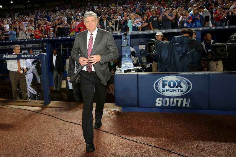 Former Atlanta Braves great Dale Murphy walks on to the field for a pre-game ceremony before the home opener against the New York Mets, Friday, April 10, 2015, in Atlanta. Atlanta won 5-3. (AP Photo/Kevin Liles)