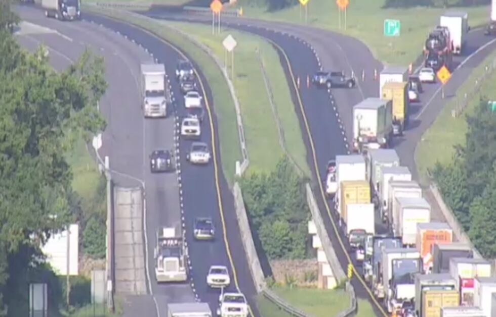 Oil spills into Lake Hartwell after semi hauling cars overturns, closes I-85