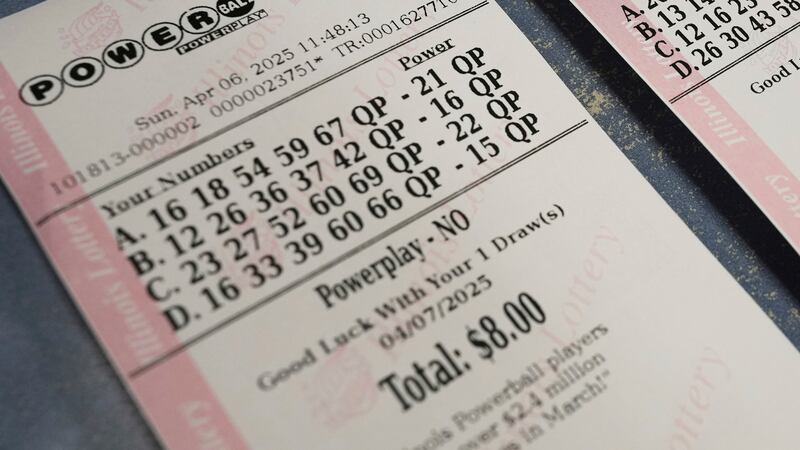Purchased Powerball and Mega Millions tickets are shown at Mares Mart in Chicago, Sunday,...
