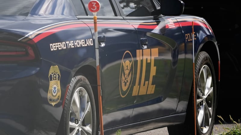 An Immigration and Customs Enforcement vehicle is parked outside the U.S. Immigration and...
