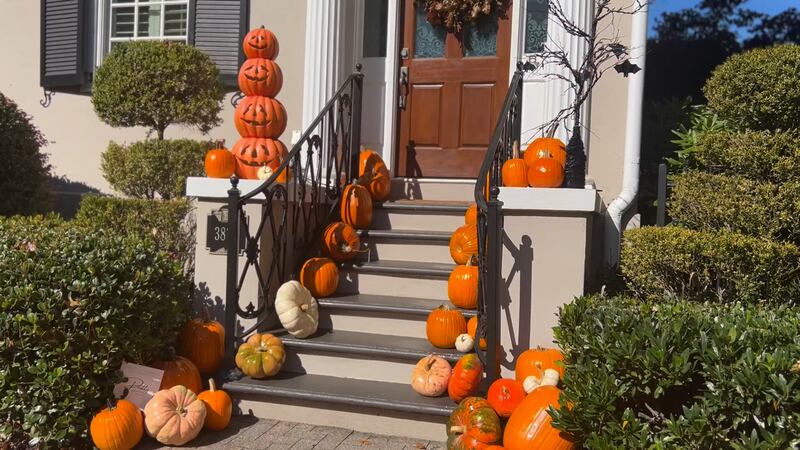 A front porch in Georgia decorated with pumpkins.