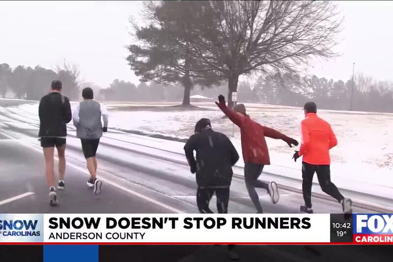 Runners keep running during snowfall in Anderson County